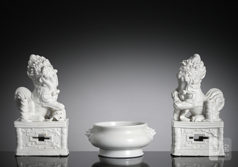 A pair of white-glazed Buddhist lions and incense burner made of Dehua porcelain